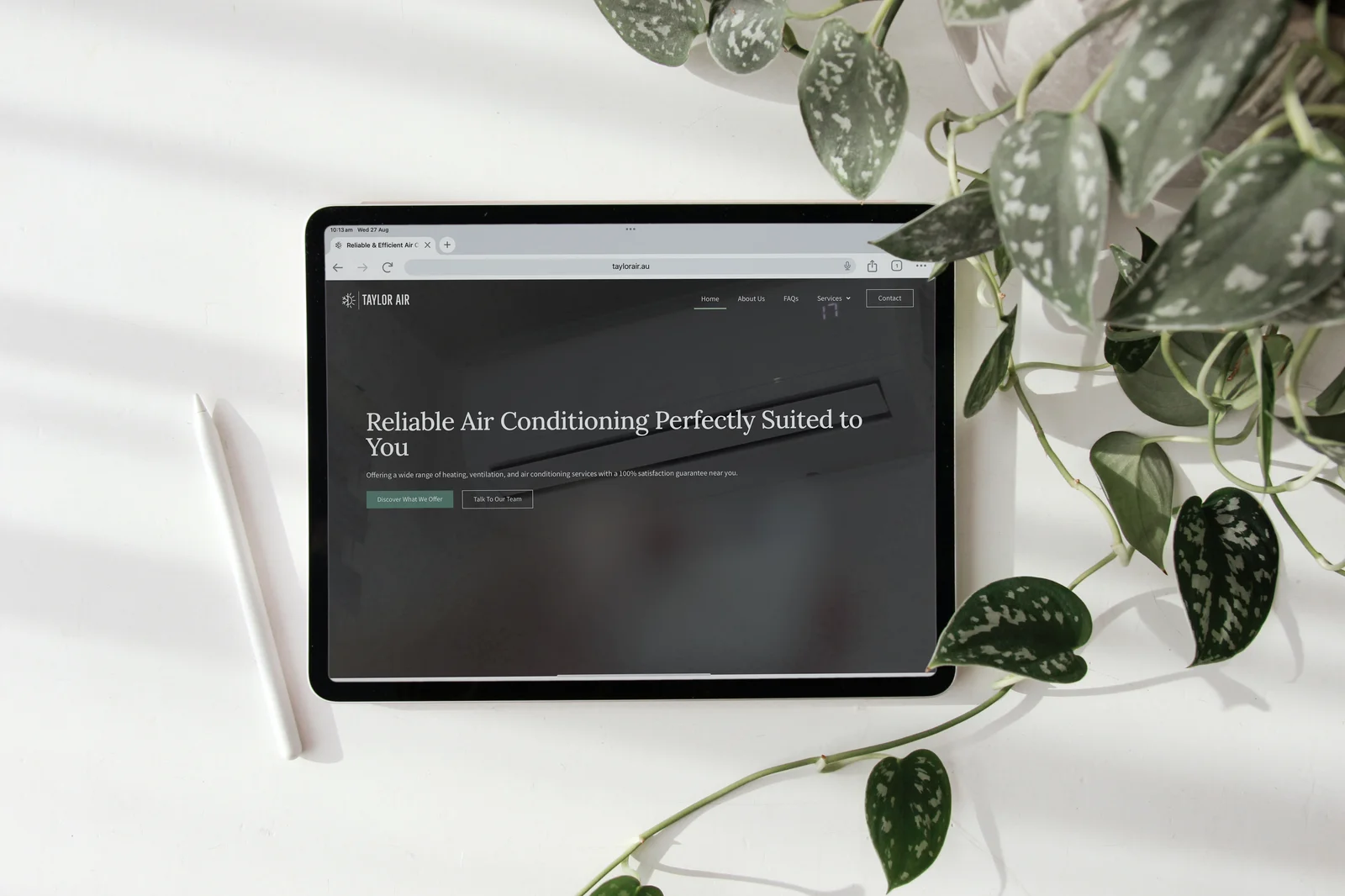 Tablet displaying a website for Taylor Air, promoting reliable air conditioning services with a focus on customer satisfaction.